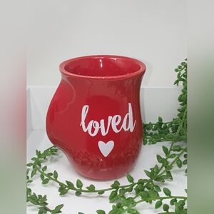 Red Hand Warmer Mug with 'Loved' Inscription